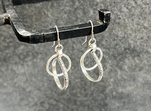 Abstract Interlocking-Hoops