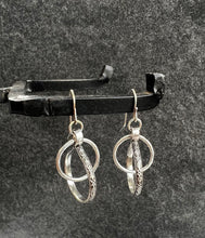 Abstract Interlocking-Hoops